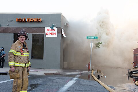 A firefighter stands outside of the smoldering Ethiopian restaurant Bolé Express in St. Paul, Minnesota on May 28, 2020.
